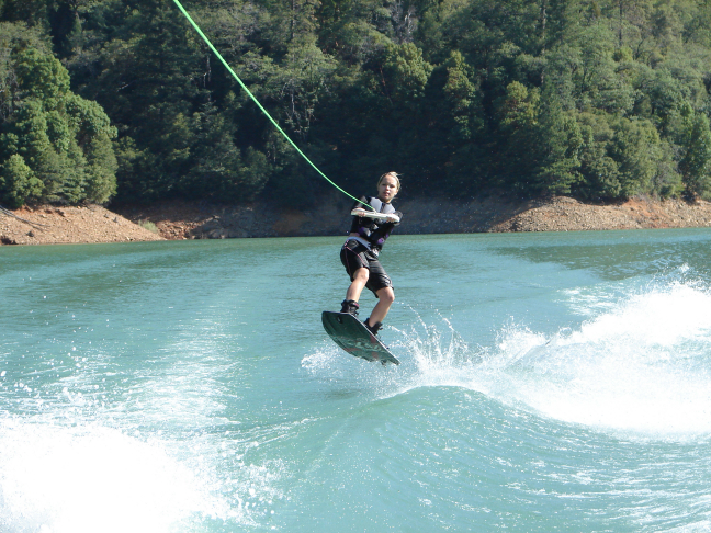 Brittney catching air on wakeboard